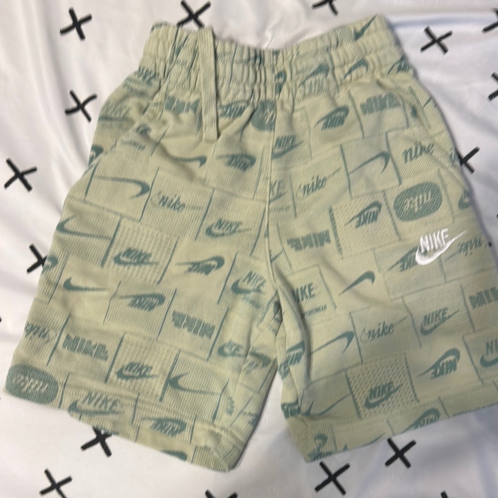 Nike Green Athletic Shorts with Logo Pattern